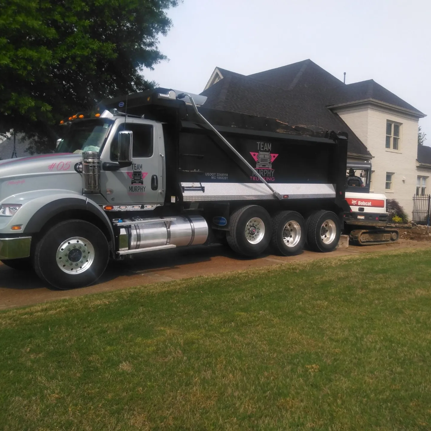 A large truck parked in front of a house.